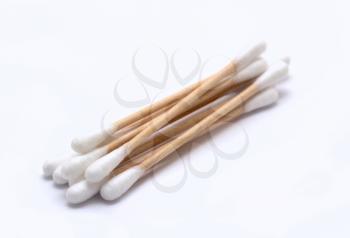 A heap of ecological recyclable cleaning cotton swabs from recycled paper. It used for better environmental conservation. Cotton swabs on white background.