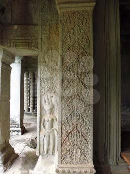 the column that is decorated with floral ornaments and bas-relief women