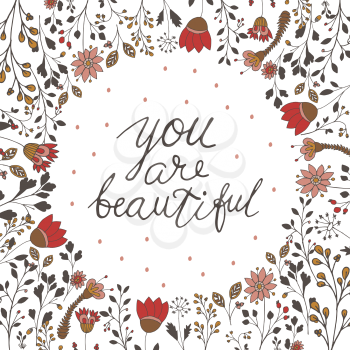handwritten inscription lettering You are beautiful with doodle flowers. Can be used for card. Vector illustration.