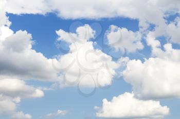 Clear blue sky with White Fluffy clouds as background 