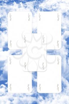 Joker Playing Cards Scatered Over The Blue Cloudy Sky