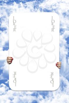 Joker Playing Card On A Cloudy Sky Background