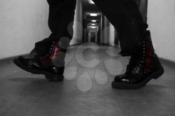 Men's Leather High Combat Boots In A Long Hallway