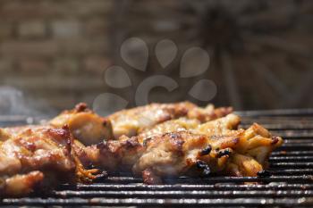 Grilled Crispy Chicken Meat On Smoking Barbecue With Rosemary 