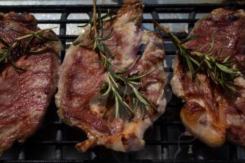 Pork Steaks With Rosemary Grilling on a Hot Barbecue