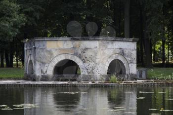 Stone Monument In The Pond At Laxemburg Castle in Lower Austria