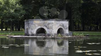 Stone Monument In The Pond At Laxemburg Castle in Lower Austria