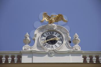 Schonbrunn Palace or Schloss Schenbrunn. Clock at the top of the building