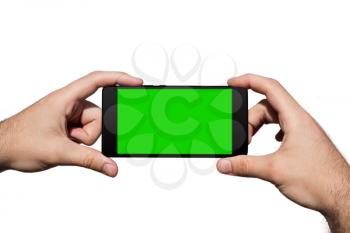 Smartphone in Hands With Green Screen For Copy Space Isolated On White Background