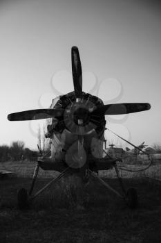 Old Rusted Propeller Airplane Abandoned in Junkyard at the Airport