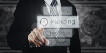 Businessman Pressing Button, Icons on Virtual Screen. Funding, Growth, Strategy Concept