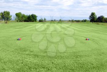 Green grass golf field tee area