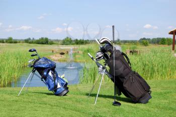 Two golf bags on golf field