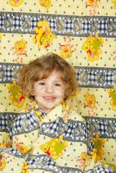 Beauty happy little girl in colorful linen