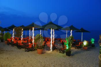 Night scene twilight over beach open cafe