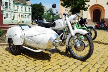 Old white vintage motorcycle with trailer