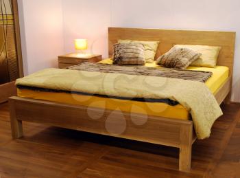 Bedroom with wooden bed and wool