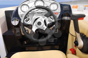 Yacht dashboard with steering wheel and gearshift
