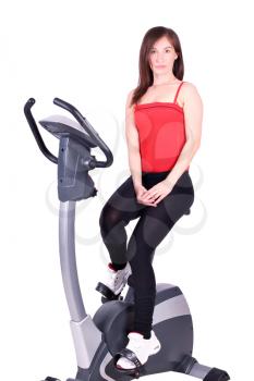 fitness girl with cross trainer posing