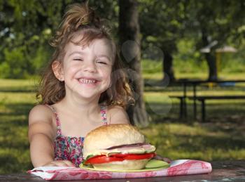 happy little girl picnic in park