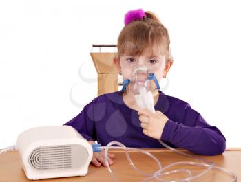 little girl taking inhaled