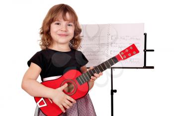 little girl with guitar posing