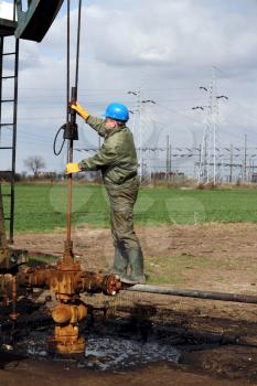 oil worker check oil pump