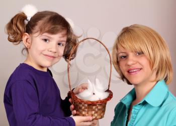 mother and daughter with cute dwarf rabbit