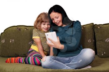 teenage and little girl playing with tablet pc