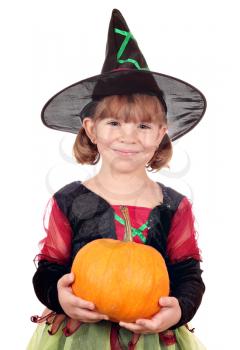 happy little girl witch holding pumpkin