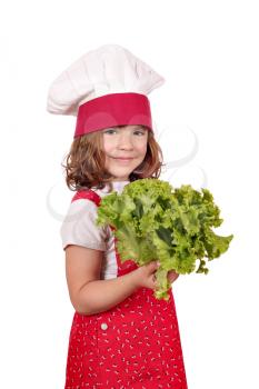 little girl cook holding green salad