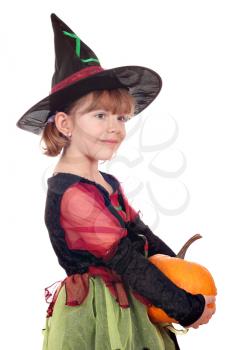 little girl witch holding pumpkin on white 