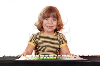 happy little girl play music on keyboard