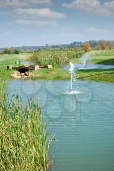 golf field with pond landscape