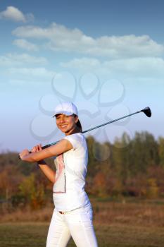 beautiful girl golf player on field