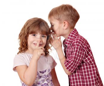 boy whispering a secret little girl 