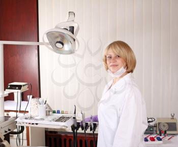 female dentist with equipment in dentist office