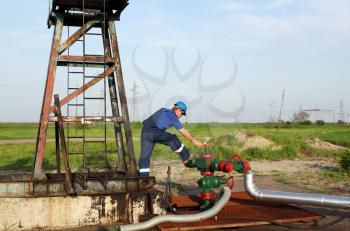 oil worker check pipeline on oilfield