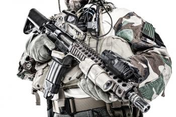 Special forces United States in Camouflage Uniforms studio shot. Holding weapons. Studio shot isolated, cropped