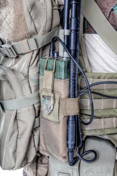 Army radio in the pouch closeup shot folding antenna