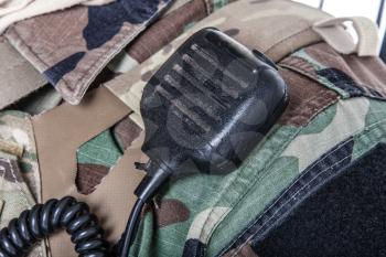 Army radio microphone on uniforms closeup shot