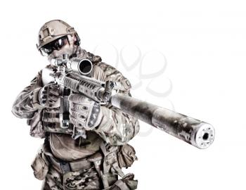 Half length low angle studio shot of big muscular soldier in field uniforms with sniper rifle, portrait isolated on white background lot of copyspace. Protective goggles glasses are on