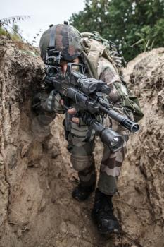 Paratroopers of french 1st Marine Infantry Parachute Regiment RPIMA in entrenchments, closeup