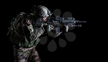Paratrooper of french 1st Marine Infantry Parachute Regiment RPIMA studio shot firing pointing weapons