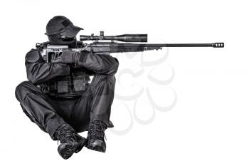 Police special forces, security operations team, SWAT group sniper in blank black uniforms, sitting and aiming with sniper rifle equipped telescopic optical sight, isolated on white studio shoot