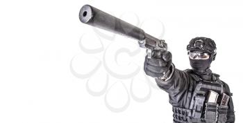Close up photo of silencer on pistol barrel in hands of police or army special forces fighter in black uniform and helmet, with hidden behind mask face, aiming in camera, isolated on white background
