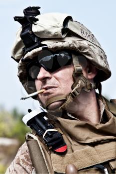 US marine smoking a cigarette half-turned to the camera