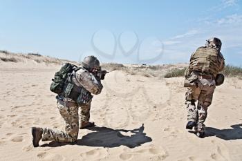 Two soldiers in the desert during the military operation