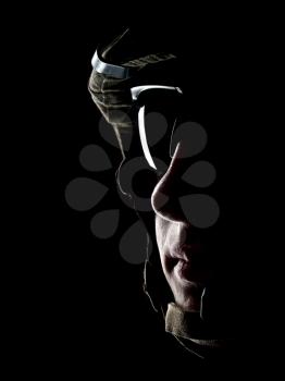 US soldier in the helmet on the black background