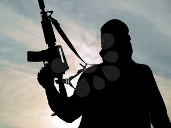 Silhouette of soldier with rifle 